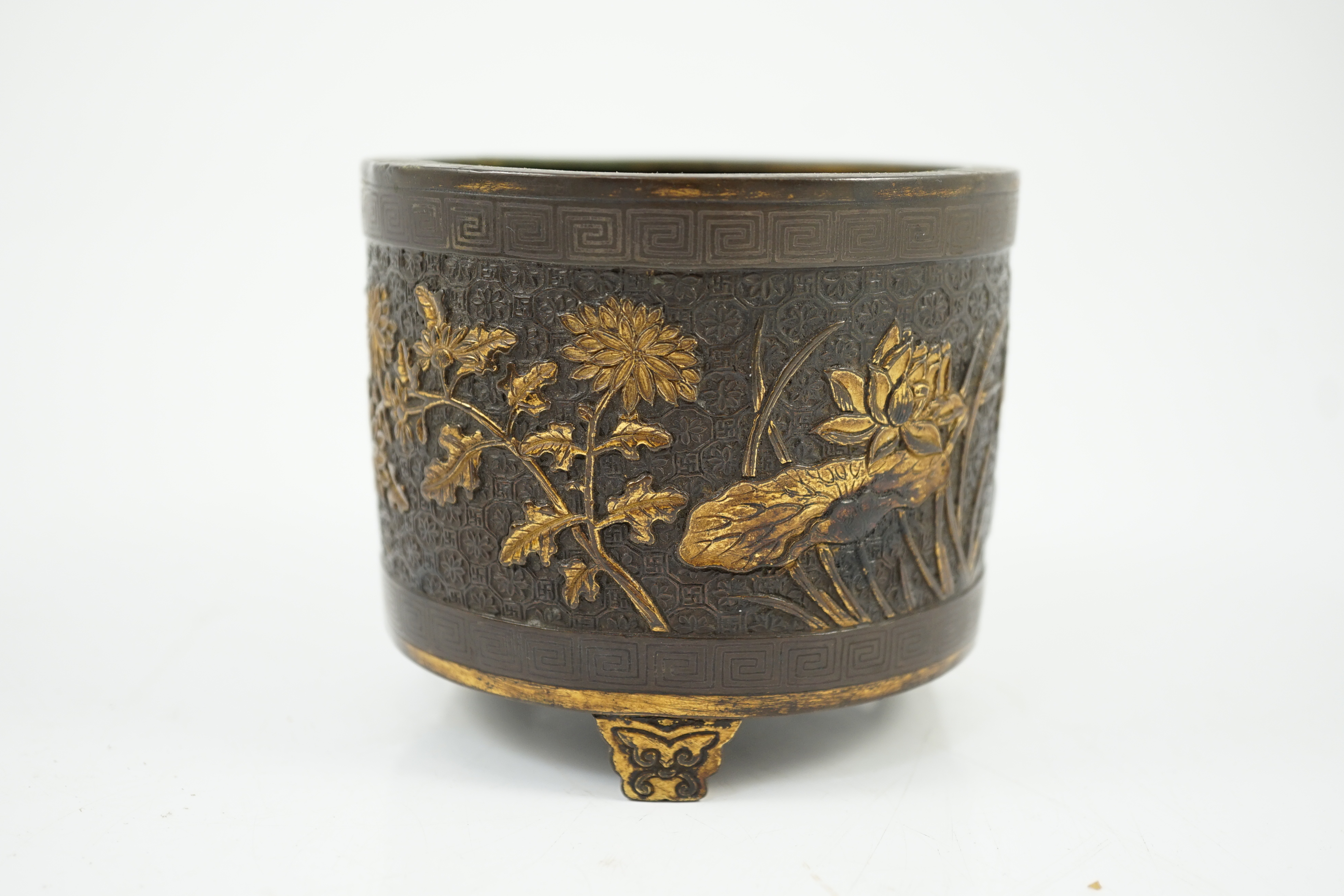 A Chinese parcel-gilt and silver inlaid bronze tripod censer, Yunjian Hu Wenming mark, 16th/17th century, small dents and three rim splits